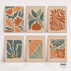 four framed art pieces with different designs on them, each featuring an orange flower and leaves