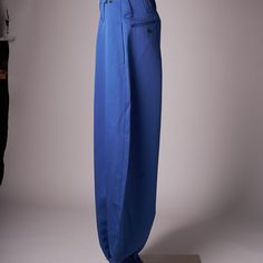 The Pants Are In Deadstock Condition With Tags Still Attached. Royal Shade Of Blue. There Are 2 Hip Pockets, A Small Front Pocket, 2 Button Back Pockets And Side Utility Pocket. Zipper At The Ankles Which Allows The Pants To Hang Over And Give A Wide Baggy Look. Measures 38 Cm Across Waist, 30 Cm Rise, 114 Cm Inseam Fitted Blue Pants With Hip Pockets, Blue Baggy Bottoms With Hip Pockets, Fitted Blue Bottoms With Hip Pockets, Blue Cargo Pants For Workwear, Blue Baggy Tapered Leg Bottoms, Blue Cargo Pants With Belt Loops For Spring, Blue Tapered Leg Bottoms With Pockets, Blue Parachute Pants With Loose Fit, Blue Tapered Leg Cargo Pants For Work