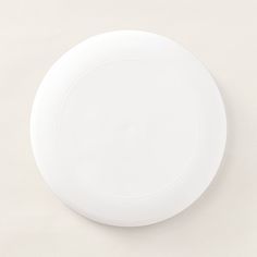 a white plate sitting on top of a table