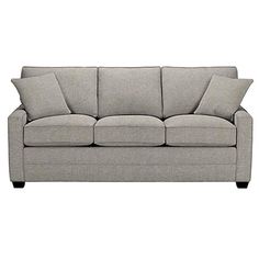 a gray couch sitting on top of a white floor