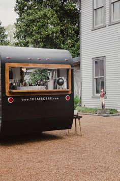 a food truck parked in front of a house