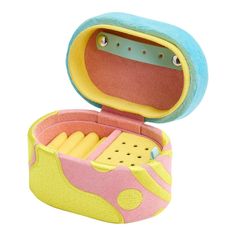 an open pink and yellow box with toothbrushes in it on a white background