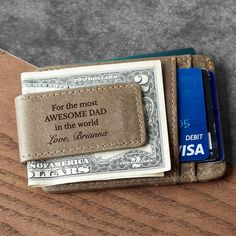 "Personalized with meaningful message on the clip and on front side, this money clip will be the perfect gift for your Dad at Christmas or a special day. P R O D U C T ∙ I N F O * Word limit: 10-18 words on the clip side/20-25 words on the card side * Materials: genuine leather * Dimensions: 4\"x2.9\" (10.3x7.4cm) 6 Card Slots 1 Center Slot 1 Magnetic Clip H O W ∙ T O ∙ P E R S O N A L I Z E STEP 1: Choose what you want at the drop-down options. STEP 2: Leave your instruction in \"Add your personalization\" box STEP 3: Choose your quantity and add to cart ► TURNAROUND TIME * All items are custom made to order. The turnaround time can change during peak seasons. Please check \"Announcement\" on our home page for the most current times: https://www.etsy.com/shop/ScriptLeather  * Rush your or Engraved Bifold Wallets For Gift, Classic Trifold Wallet For Father's Day, Father's Day Rectangular Wallets With Card Slots, Engraved Bifold Wallet As Gift, Engraved Bifold Wallets As Gifts, Rectangular Everyday Wallets For Father's Day, Personalized Wallets With Card Slots For Father's Day, Personalized Rectangular Wallet For Father's Day, Bifold Card Holder For Father's Day Gift