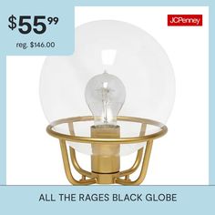 a table lamp with a glass globe on it for $ 55 99 reg $ 46 00