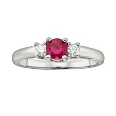 Show her how much she means to you with this gorgeous 3-stone ring.Ring Details: Width: 5.1 mm Metal: rhodium-plated 14k white gold Features: colored gem reportStone Details: IGL Certified Stone type: genuine ruby Total weight: 1/2 ct. Cut: round Setting: prongDiamond Details: IGL certified Total weight: 1/6 ct. Cut: round Color: I Clarity: I1 Setting: prongImage(s) may be enlarged to show detail.Diamond weights are approximate. Diamond total weights may vary between .01 and .08 ct. Some diamond 3 Stone Rings, Right Hand Rings, Ruby Stone, Colored Gems, Round Cut Diamond, Stone Ring, Womens Jewelry Rings, Stone Rings, Rhodium Plated