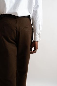 A slightly relaxed, subtly tapered pant cut from a brown organic cotton moleskin. Featuring 1/2" pleats, quarter top front pockets, single ‘hand style’ welt pocket on back right side, French seams, veg-tan leather washer backed YKK buttons, clean finish button fly and single needle belt loops. Organic Cotton Moleskin Made in California Hand numbered edition of 39 Tapered Pant, Hand Style, Veg Tan Leather, French Seam, Signature Look, Pleated Pants, Moleskine, Right Side, Welt Pocket