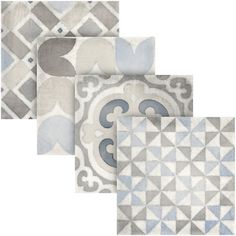 four tile designs in shades of blue, grey and white