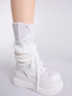 Elevate your Kawaii or Lolita outfit with these charming white/black self-tie straps knitted leg warmers. Made for the fashion-forward individual, these leg warmers feature a versatile color option of white and black, making them easy to pair with a variety of outfits. The knitted construction provides warmth and comfort, while the self-tie straps add a touch of playfulness and customization to your look.   Please note that this product includes only one pair of leg warmers. Trendy White Thigh High Leg Warmers, Trendy White Thigh-high Leg Warmers, White Thigh High Leg Warmers For Fall, White Harajuku Knee-high Socks For Winter, White Thigh High Leg Warmers For Winter, White Thigh-high Leg Warmers For Winter, Harajuku Style White Knee-high Leg Warmers, White Harajuku Knee-high Leg Warmers, White Harajuku Style Knee-high Leg Warmers