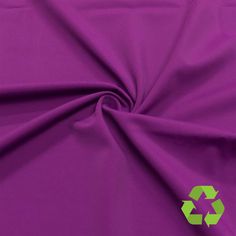 a purple fabric with a recycle symbol on the front and green recycling symbols on the back