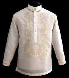 Keep it sharp and streamlined in this Piña-Jusi Barong Tagalog. Expertly made in our Jusi fabric with Chinese collar and hand-embroidery Color: Beige Traditional collar, cuff buttons Classic Formal fit Fully Lined Return or Exchange Policy: You may return or exchange the items within 10 days (the 10 days starts from the day you receive the order.) All claims MUST be made within 3 days upon receiving the order. Shipping charges will not be refunded. Returned products must be in absolutely new and Traditional Long Sleeve Shirt With Intricate Embroidery, Formal Long Sleeve Tops With Embroidered Cuffs, Fitted Long Sleeve Kurta With Embroidered Cuffs, Formal Long Sleeve Blouse With Embroidered Cuffs, Semi-formal Long Sleeve Embroidered Kurta, Formal Long Sleeve Tops With Intricate Embroidery, Festive Long Sleeve Embroidered Shirt, White Long Sleeve Festive Shirt, Traditional Fitted Shirt With Buttons