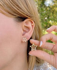 Fun and unique Star Ear Jacket Earrings made of premium Sterling Silver.  You can rock these stars in multiple ways! Pop in the small star stud and keep it simple yet stylish. Ready to turn heads? Attach the star backing for an instant glam boost! And guess what? That star backing is a team player - pair it up with almost any other stud earring for a mix-and-match masterpiece. The Silver version is rhodium-plated for extra shine and added durability. They are also available with a luxurious Gold Everyday Celestial Star Earrings, Celestial Star-shaped Earrings For Pierced Ears, Everyday Star Shaped Pierced Earrings, Celestial Star-shaped Hypoallergenic Earrings, Celestial Star Hypoallergenic Earrings, Celestial Star Cartilage Earrings As Gift, Celestial Star-shaped Pierced Earrings, Double Sided Earrings, Gold Fronts