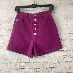 Women's Vintage BONGO Denim Shorts Juniors Size 5.  Fuchsia 5 Pocket with Button Front  made of 100% Cotton.  Gently Used.  Please check sizing as Vintage tends to run small.  Please see pictures for details.   Side to Side - 12" Length - 14.5"  Inseam - 3" Rise - 13" Thank you for shopping with us, we appreciate your business. *All items are measured laying flat, non-stretched, please be sure to check sizing before purchasing Pink Button-up Bottoms For Summer, Pink Buttoned Summer Bottoms, Pink Summer Bottoms With Buttons, Pink Cotton Bottoms With Button Closure, Pink Summer Bottoms With Button Closure, High Rise Cotton Bottoms With Snap Buttons, High Rise Cotton Bottoms, High Rise Purple Bottoms With Pockets, High Waist Shorts With Snap Buttons For Spring