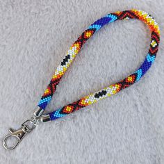 a dog leash with multicolored beads on it