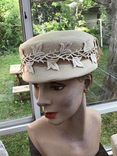 "Vintage 1950s 1960s Light Beige straw hat. Has fabric appliqués of leaves surrounding the crown. Also a Velvet ribbon. The label reads: Imported Braid. CONDITION: I note a tiny spot on one of the appliqués on the right side (SEE PIX). MEASURES: Inside circumference-22\" Crown height-3\" Left to right-7 1/2\" Front to back-8\" **WE APOLOGIZE~BUT WE CAN NO LONGER SHIP TO ITALY OR SPAIN. WE HAVE INCURRED TOO MANY ISSUES WITH SHIPPING. PACKAGES GOING MISSING..DAMAGED...ETC. IF ORDERS COME IN FROM I Vintage Cream Costume Hat With Curved Brim, Vintage Cream Costume Hats And Headpieces For Events, Vintage Cream Hat For Vintage Events, Cream Vintage Hat For Vintage Events, Vintage Costume Hats With Structured Crown, Adjustable Vintage Cream Costume Hat, Adjustable Cream Vintage Costume Hat, Vintage Beige Hats For Vintage Events, Beige Vintage Hats For Vintage Events