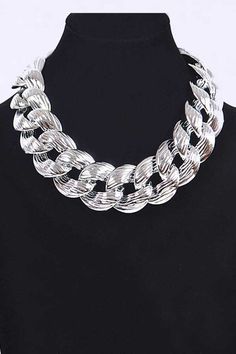 This elegant all-around collar necklace features stunning links that adds a touch of sophistication to any outfit. You'll love the bold and timeless look it brings to your wardrobe. Necklace - 18" + ExtensionLead & Nickel Compliant Photo may have been enlarged and/or enhanced Elegant Chain Link Choker For Party, Elegant Chunky Chain Link Choker, Elegant Chunky Jewelry Choker, Elegant Chunky Choker Jewelry, Elegant Chunky Choker, Chic Silver Round Chain Necklace, Elegant Chunky Necklaces For Parties, Elegant Chunky Necklace For Parties, Elegant Silver Chunky Necklace