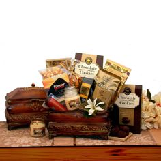 a wooden box filled with lots of different types of food and snacks on top of a table