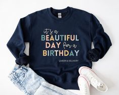 It's a Beautiful Day for a Birthday! This Labor and Delivery sweatshirt is sure to be a big hit everywhere you go. Our cozy crewnecks are perfect for staying warm during rounds in the hospital, or while running errands. Find this design on a TSHIRT: https://www.etsy.com/listing/1416110327/labor-and-delivery-shirt-ld-tshirt-baby?ref=listing_published_alert S I Z I N G: ----------------- These sweatshirts are unisex. Please refer to the size chart prior to ordering. S H I P P I N G & R E TU R N S: ----------------------------------------- These products are made to order and ship out within 5 business days. Because of this, returns cannot be accepted. If your product was damaged during shipment, please contact me. Lost packages: We are not responsible for incorrect delivery addresses, or for Graphic Print Sweatshirt For Birthday And Mother's Day, Mother's Day Birthday Graphic Print Sweatshirt, Birthday Letter Print Relaxed Fit Sweatshirt, Relaxed Fit Letter Print Sweatshirt For Birthday, Mother's Day Birthday Crew Neck Sweatshirt, Baby Nurse, Neonatal Nurse, Nursing Student Gifts, Nursing Baby