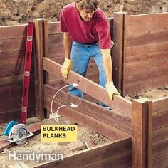 a man is working on some wooden planks