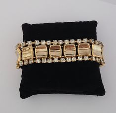 Lovely Vintage Bracelet Polished Goldtone Metal Links with Clear Color Crystals. Chic and elegant bracelet with an art-deco feel, in goldtone metal bracelet.  In good vintage condition. For new arrivals check out the store's Instagram account https://www.instagram.com/helensjewellerybox/ All jewellery is photographed in natural light and may have light scratches due to age and wear* Thank you for looking and if you have any questions please don't hesitate to ask :) Formal Gold Metal Stretch Bracelet, Gold Jubilee Stretch Bracelet For Formal Occasions, Art Deco Gold Bracelet For Formal Occasions, Art Deco Gold Wedding Bracelets, Gold Art Deco Wedding Bracelets, Retro Gold Bracelets For Party, Retro Gold Party Bracelets, Vintage Gold-tone Bracelets For Party, Vintage Gold Bangle Stretch Bracelet