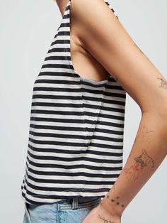 Featuring a classic crewneck, effortlessly draped fit, and a semi cropped length (for an effortless French tuck), it's the easiest muscle tee in your rotation. Trust us. (This one comes in black and white City Stripe.) | Women's Collins Tank Top in City Stripe | Ethical Essentials Chic Crew Neck Cropped T-shirt For Summer, Effortless Everyday Crew Neck Tops, Versatile Crew Neck Tops For Everyday, Versatile Everyday Crew Neck Tops, Everyday Crew Neck Tops, Effortless Tops With Shirttail Hem, Effortless Top With Shirttail Hem, Effortless Shirttail Hem Top, Relaxed Fit Scoop Neck Crop Top For Summer