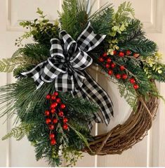 a christmas wreath hanging on the front door