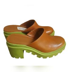 Elevate Your Shoe Game With These Gianni Bini Gb End-Game Leather Mules. These Y2k Style Shoes Have A Closed Toe Design And A Slip-On Closure, Making Them Perfect For Casual Or Travel Occasions. The Brown And Green Is A Beautiful Color Together 1-Inch Platform And Mid-Height Block Heel Give You A Comfortable Lift. Made With Synthetic Lining And Rubber Outsole, These Mules Offer Durability And Long-Lasting Wear. The Size 8m Shoes Are Designed For Women And Have A Medium Width. The Gb End-Game Mod Green Leather Slip-on Heels, Brown Heels With Rubber Sole For Spring, Spring Closed Toe Heels With Lug Sole, Leather Heels With Lug Sole, Slip-on, Trendy Lug Sole Heels For Spring, Trendy Spring Heels With Lug Sole, Brown Synthetic Heels With Rubber Sole, Green Round Toe Heels With Rubber Sole, Spring Heels With Lug Sole And Round Toe