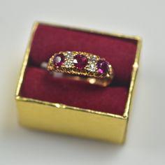 British hallmarks, natural mine cut vivid red rubies, old mine cut diamonds. 18 karat assay mark British Sheffield hallmark (Crown) T hallmark age 1787 1.0 carats total weight of fine natural rubies .20 carats of natural old mine cut diamonds Some normal wear for the age of the ring, sold as is Red Diamond Ring With Rose Cut Lab-created Ruby, Heirloom Style Red Ruby Ring With Brilliant Cut, Antique Ruby Ring With Single Cut Diamonds, Red Diamond Rings With Rose Cut, Red Ruby Ring With Rose Cut Diamonds, Fine Jewelry Red Diamond Ring With Rose Cut, Red Ruby Ring With 17 Jewels In Round Cut, Heirloom Style Brilliant Cut Ruby Ring As Gift, Heirloom Style Ruby Ring With Brilliant Cut