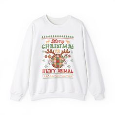 Get into the festive spirit with this Merry Christmas Ya Filthy Animal Home Alone Christmas Sweatshirt. Perfect for cozying up by the fire or attending holiday gatherings, this sweatshirt exudes a fun and casual vibe. Ideal for fans of the classic Christmas movie 'Home Alone' and anyone looking to add a touch of humor to their holiday wardrobe. Product features - Unisex heavy blend sweatshirt made with a cozy fabric blend of 50% cotton and 50% polyester - Ribbed knit collar with seam for elasticity and shape retention - Ethically made with 100% US-grown cotton and OEKO-TEX-certified dyes - Classic fit with double-needle stitching for durability - Tubular knit design reduces fabric waste and enhances the garment's appearance Care instructions - Machine wash: cold (max 30C or 90F) - Non-chlo Festive Cozy Crew Neck Sweater, Christmas Holiday Crew Neck Sweater, Christmas Cotton Long Sleeve Sweater, Cozy Christmas Crew Neck Sweater, Cozy Christmas Sweater With Crew Neck, Festive Long Sleeve Cotton Sweater, Christmas Crew Neck Cotton Sweater, Christmas Cotton Crew Neck Sweater, Festive Holiday Cotton Sweater