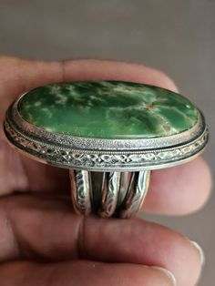 This is a lovely Natural Australian Variscite, green in color oval in shape.  Measuring 35mm x 20mm. The shank is 11mm wide at the bottom (palm side). It is made with Sterling and Fine Silver.  Substantial and all handmade and unique! Filled with heart&soul! Size: 7.25 Please contact me with any questions.  Thank you for visiting QuintessentialSilver! Susan Oval Green Jewelry With Polished Finish, Green Chrysoprase Oval Pendant Jewelry, Unique Green Polished Turquoise Ring, Green Oval Turquoise Gemstone Ring, Untreated Green Oval Rings, Unique Green Turquoise Ring With Polished Finish, Handmade Oval Green Ring, Handmade Green Oval Ring, Green Oval Turquoise Artisan Ring