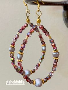 On of a kind beautiful hoop earring in beautiful warm colors made from hand wrapped wire, Czech faceted iridescent glass beads, freshwater grayish pearls.  Matching bracelet available in the Bracelet sections.   Perfect for the holidays, goes with every color, and amazing for a day earrings. All hand crafted and very pretty in real life. Earrings Fancy, Earrings Chandelier, Fancy Earrings, Earrings Hoop, Matching Bracelet, Bohemian Earrings, Earrings Long, Matching Bracelets, Jewelry Earrings Hoops