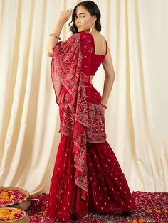 Please check the last image for a detailed size chart Ready to wear Prestitched Sharara Pants Saree The co ords set consists of a crop top, sharara & attached pleated dupatta Red/Green solid crop top has v neck & sleeveless sleeve Red/Green printed sharara, has an elasticated waistband with a slip-on closure Red/Green printed pleated frill dupatta Fabric: Poly Georgette Pattern: Printed Style: Sharara Saree, Pant Suit Set For Women, Ready to wear Saree, Indo-Western Dress Wash Care: Dry Clean Di Red Chikankari Embroidered Sharara In Georgette, Red Georgette Sharara With Chikankari Embroidery, Georgette Sharara For Puja, Designer Red Saree With Chikankari Embroidery, Red Chikankari Embroidery Designer Saree, Red Georgette Sets With Chikankari Embroidery, Red Georgette Sharara With Unstitched Blouse, Red Sharara With Unstitched Blouse, Red Chikankari Embroidery Blouse Piece