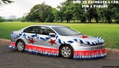 a silver car with red, white and blue decorations on it