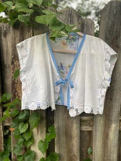 This Crop Tops item is sold by GrandmasGarbo. Ships from Chesterfield, VA. Listed on Aug 4, 2024 Diy Tie Front Top, Hankies Ideas, Tie Front Vest, Reworked Clothes, Tie Vest, Lace Table Runner, Diy Tie, Lace Table Runners, Visible Mending