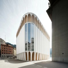 an unusual building with curved windows on the outside