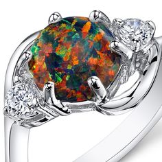 A galaxy of colors Embrace the enchanting feeling of the Northern Borealis This versatile ring features a round shape Peora created Opal gemstone in .925 sterling silver. Responsibly sourced in every sense, our created Opal gemstones are physically, chemically, and optically identical to their natural counterparts. We're big fans of eco-luxury. Handcrafted in pure .925 sterling silver goodness, this ring has been carefully coated in an elegant rhodium finish. Our artisans are expertly trained in Independent Thinker, Black Opal Engagement Ring, Sterling Silver Opal Ring, Fashion Rings Silver, Black Opal Ring, Silver Opal Ring, Opal Engagement, Engagement Rings Opal, Paying Attention