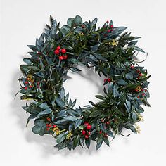 a wreath with red berries and green leaves