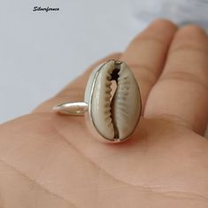 Natural Money Cowrie Sea shell ring, handmade ring, gift ring, Natural Sea shell ring, boho ring, women's ring, statement ring, Gift For Her Benefits Of Gemstone : It brings good luck, wealth, prosperity, fame and the power of destiny. Cowry shells are used in some religious or auspicious ceremonies too, like in Laxmi puja Kaudi shells are kept to please Goddess Laxmi and be blessed by Her and Lord Vishnu Those who have these cowries with them during prayer gets the blessing for both Lord Shiva Laxmi Puja, Goddess Laxmi, Cowry Shell, Shell Ring, Lord Vishnu, Ring Boho, Boho Ring, Gift Ring, Ring Fit