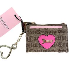 Juicy Couture Brown Wallet With Classic Logo And A Lovely Pink Heart Centered With Heart Shape Keychain Pink Wallets With Card Slots For Valentine's Day, Pink Card Holder With Zipper Closure As Gift, Pink Heart-shaped Wallets For Gifts, Pink Heart-shaped Wallet For Gift, Heart-shaped Pink Wallet As Gift, Pink Heart-shaped Wallets For Valentine's Day, Pink Card Holder With Interior Key Chain As Gift, Heart Shape Keychain, 23 Fashion