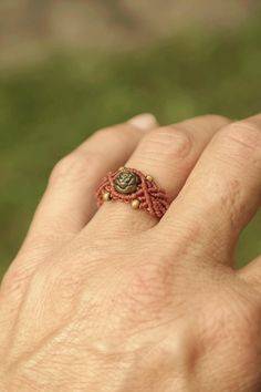 a woman's hand with a ring on it