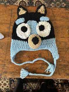 a crocheted hat with an animal's face on it