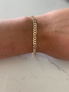 This 14K Yellow Gold Cuban Link Bracelet boasts an impressive 4.8MM width and 8" length. Crafted from 14K gold and featuring a lobster clasp, this luxurious piece is ideal for both men and women. Show off your style with this solid and real gold bracelet. ------------------------------------------- ------------------------------------------------- Great bracelet for everyday wear. It is 14K solid Gold. The 14K Gold Bracelet makes a great gift for any loved one Birthday present. Get yours today. Male Bracelets Gold For Men, Gold Bracelets For Men, Gold Cuban Link Bracelet, Silver Evil Eye Bracelet, Bracelet Or, Real Gold Bracelet, Bracelet Measurements, Mens Glasses Fashion, Cuban Bracelet