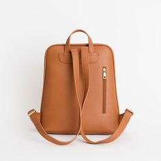 The Olivia Backpack is the most sleek and stylish backpack we've made! Conveniently made to store all the necessary things, including any 13" laptop.  Plenty of pockets to hold and store all the essentials (phone, Chapstick, wallet, hand sanitizer, etc.). Use it for work, school, travel, and everything else in-between. Backpack With Luggage Sleeve For On-the-go, Everyday Rectangular Backpack With Luggage Sleeve, On-the-go Laptop Backpack With Zipper Pocket, Classic Rectangular Travel Backpack, Modern Softback Backpack For On-the-go, Versatile Laptop Backpack With Zipper Pocket, Modern Backpack With Luggage Sleeve For Back To School, Versatile Backpack With Zipper Pocket For School, Versatile School Backpack With Zipper Pocket