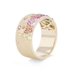 Crafted in a cigar style, this band features a stunning display of scattered rainbow colored sapphires totaling 1.36 carats. It measures 8.7 millimeters wide. Colored Sapphires, Diamonds Direct, Rainbow Sapphires, Future Engagement Rings, Jewelry Inspo, Fashion Jewellery, Girls Fashion, Cute Jewelry, Luxury Jewelry