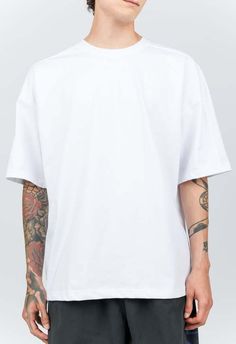 One size. fits xs-xl    color: white    oversized boxy fit    classic white tee    80% cotton 20% polyester    dry clean only    by the nkc store    chest: 122cm / 48in    length: 74cm / 29in    model is 185cm / 6'1" wearing size o/s Black Tank Dress, Black Aviators, Frill Dress, Boyfriend Tee, Engineered Garments, Mens Outerwear, Ruched Dress, White Tee, Classic White