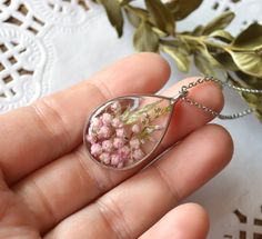 Cute and delicate pendant from resin with dried pink rice flower (ozotanamnus) and heather flower in a metal frame. Jewelery fascinatingly sparkles in the sun. Terrarium necklate will be an excellent gift for nature lover. You can choose the length of the chain. More similar products, please see here: https://www.etsy.com/shop/VivaArcenciel?section_id=18356228 Order will be securely packed in a beautiful and sturdy box. Detailed conditions refer to the rules of the store. More beautiful handmade items see here: https://www.etsy.com/shop/VivaArcenciel Thanks for visiting! Pink Resin Jewelry With Pressed Flowers, Pink Nature-inspired Jewelry For Gift, Pink Nature-inspired Jewelry For Gifts, Teardrop Pressed Flowers Jewelry Gift, Teardrop Necklace With Natural Inclusions For Gift, Handmade Botanical Necklaces As Gift, Handmade Botanical Style Necklace, Botanical Handmade Necklace Gift, Pink Flower Pendant Jewelry With Pressed Flowers