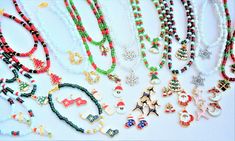 many necklaces are displayed on a white surface