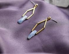 These beautiful, delicately handmade earrings are adorned with blue kyanite stones. They are very unique and simply elegant, and a perfect match both for casual and formal outfits. They are made of brass and thus free from nickel. Size: Width: ca. 1 cm Length: ca. 6.5 cm -- >> IMPORTANT INFO <<--- * Our products are unique and are * individually made. Minor deviations from the photos are therefore possible. * How can I take care of my product? To clean brass, there are various home remedies such Autumn Rain, Formal Outfits, Blue Kyanite, Take Care Of Me, Formal Outfit, Brass Earrings, Ketchup, Handmade Earrings, Home Remedies