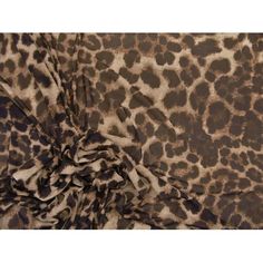 an animal print fabric with brown and black spots