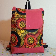 a colorful backpack sitting on top of a table