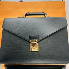 Louis Vuitton Serviette Fermoir Couseiller Epi Black Louis Vuitton Pristine Quality Pre Owned Pristine Condition But Not Perfect. Walking On Hallway With Your Suit And Carrying This Briefcase You Will Shine, W16”Xh12”D4” Approx Material Monogram Leather High Quality Made In France Date Code Number Sr1002 Exterior Excellent Condition Corner And Edges Are Excellent Condition Minor Scratches Are Hardware. No Skeleton Key Unfortunately No Worries You Can Still Unlock So You Can Still Open And Closed It. Interior No Unpleasant Smell . Doesn’t Effect The Functionality Of These Item Please See Photos Gallery Question Are Welcome Thank You. Black Louis Vuitton, Code Number, Skeleton Key, Monogrammed Leather, Not Perfect, Walk On, Authentic Louis Vuitton, Made In France, See Photo